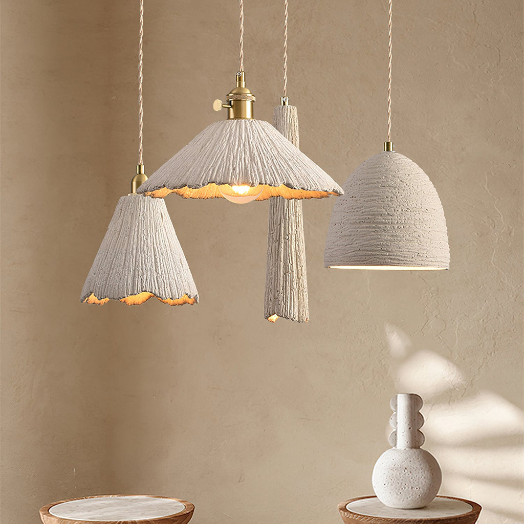 Microcement pendant light hanging against a neutral wall