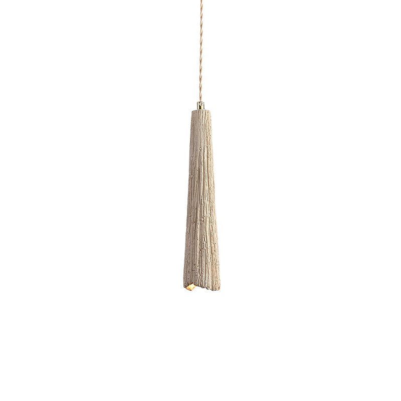 Raw microcement pendant light shown in a styled interior