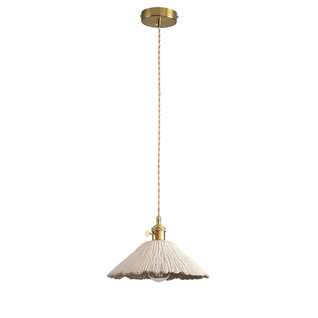 Microcement pendant light suspended over a dining area
