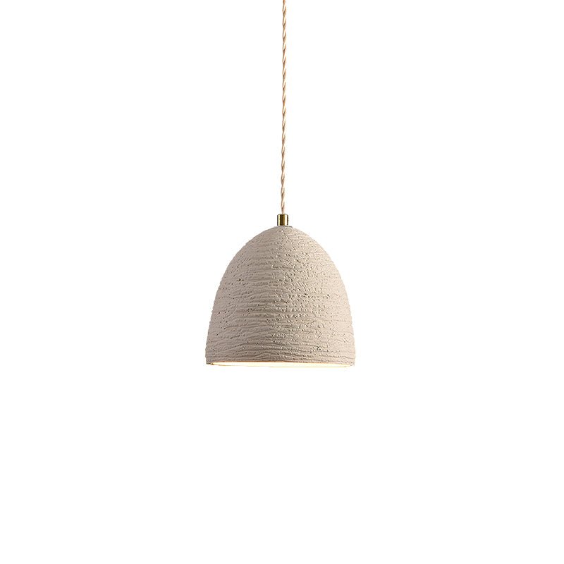 Microcement pendant light detail of the porous grey surface