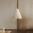 Cement pendant light close view of the gold brass fitting