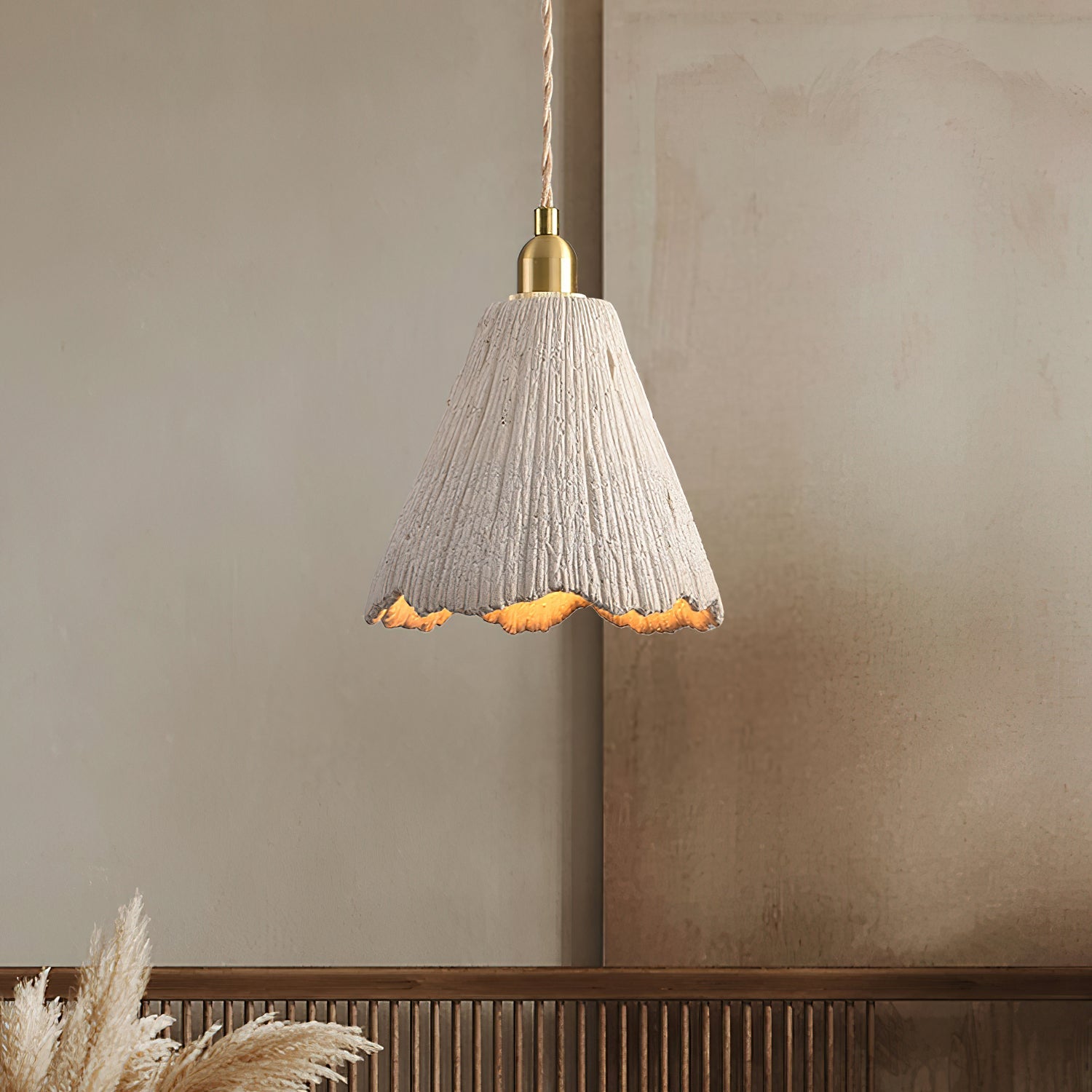 Cement pendant light close view of the gold brass fitting