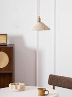 Disc shaped cement pendant light detail of the raw surface
