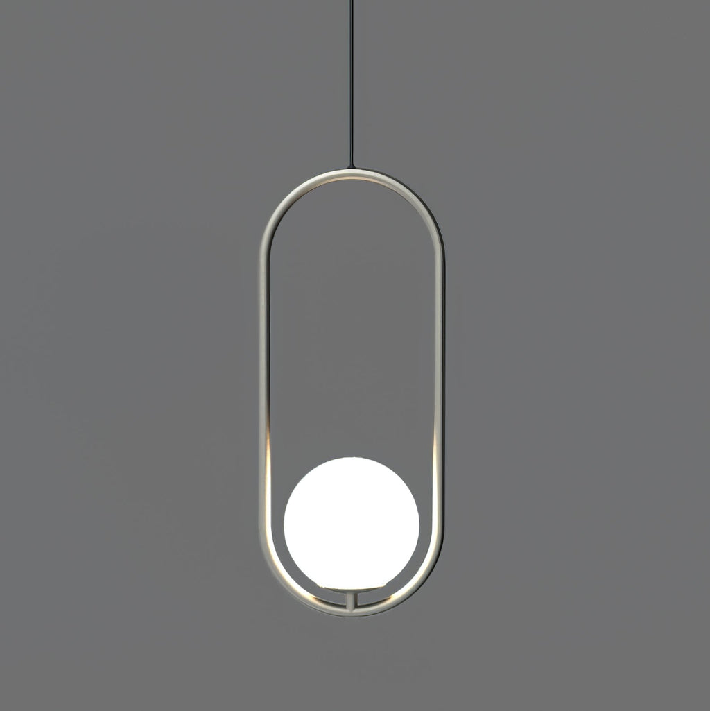 Brass pendant light holding a white glass globe shade