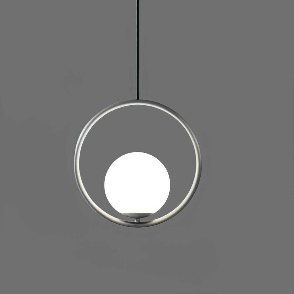 Brass and white glass pendant light suspended overhead