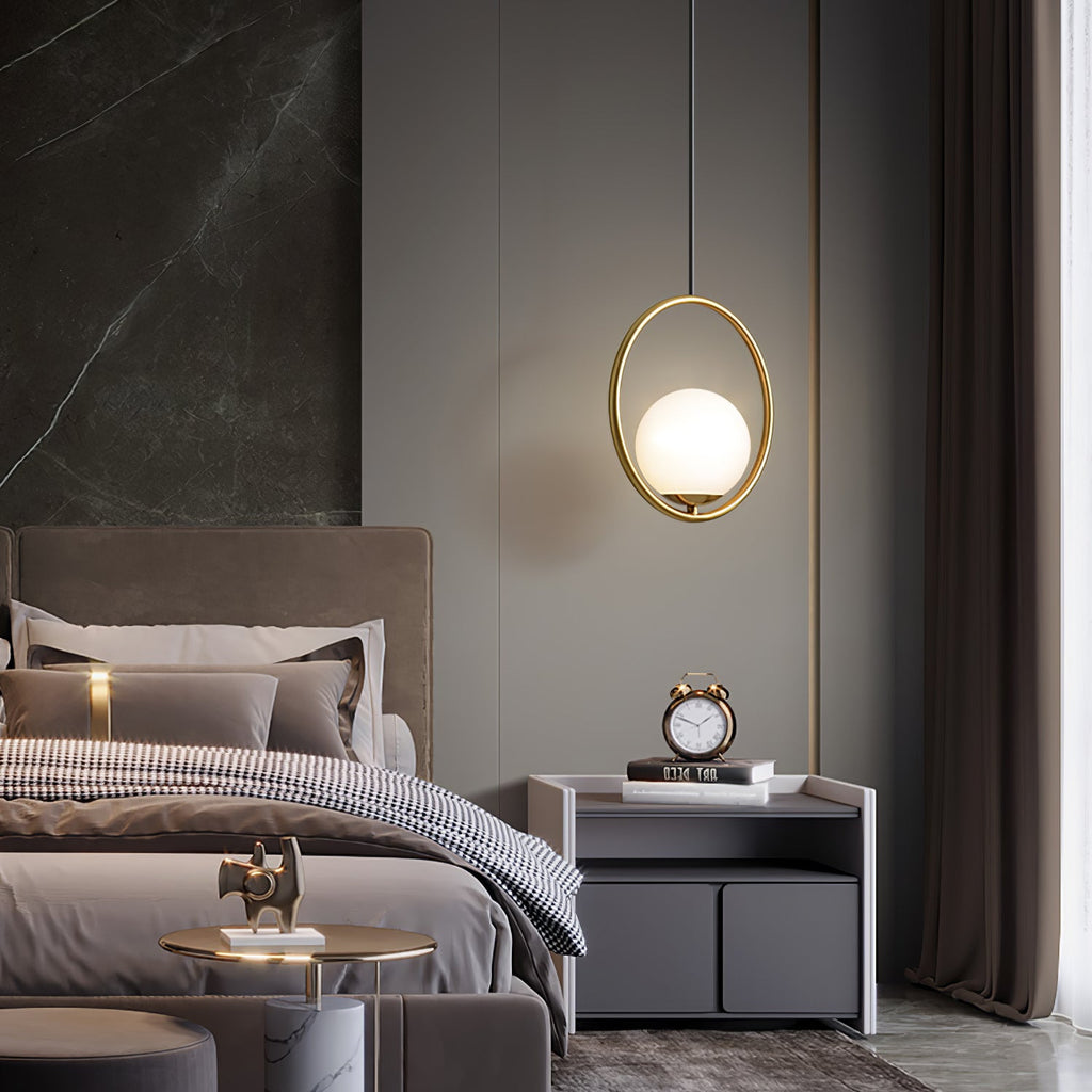 White glass pendant light suspended in a styled setting