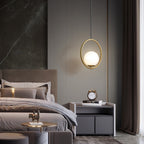 White glass pendant light suspended in a styled setting
