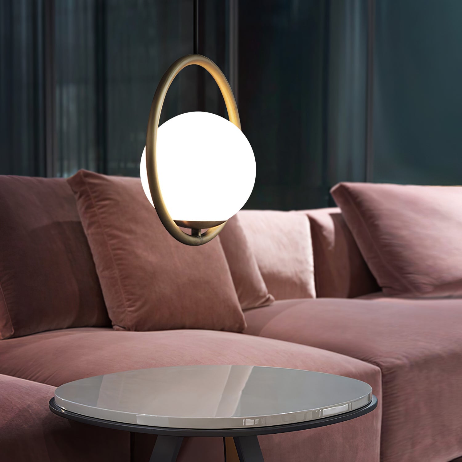 Brass pendant light with a round white glass shade