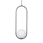 White glass ball pendant light shown lit warmly