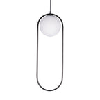 Glass ball pendant light glowing softly in a dining area