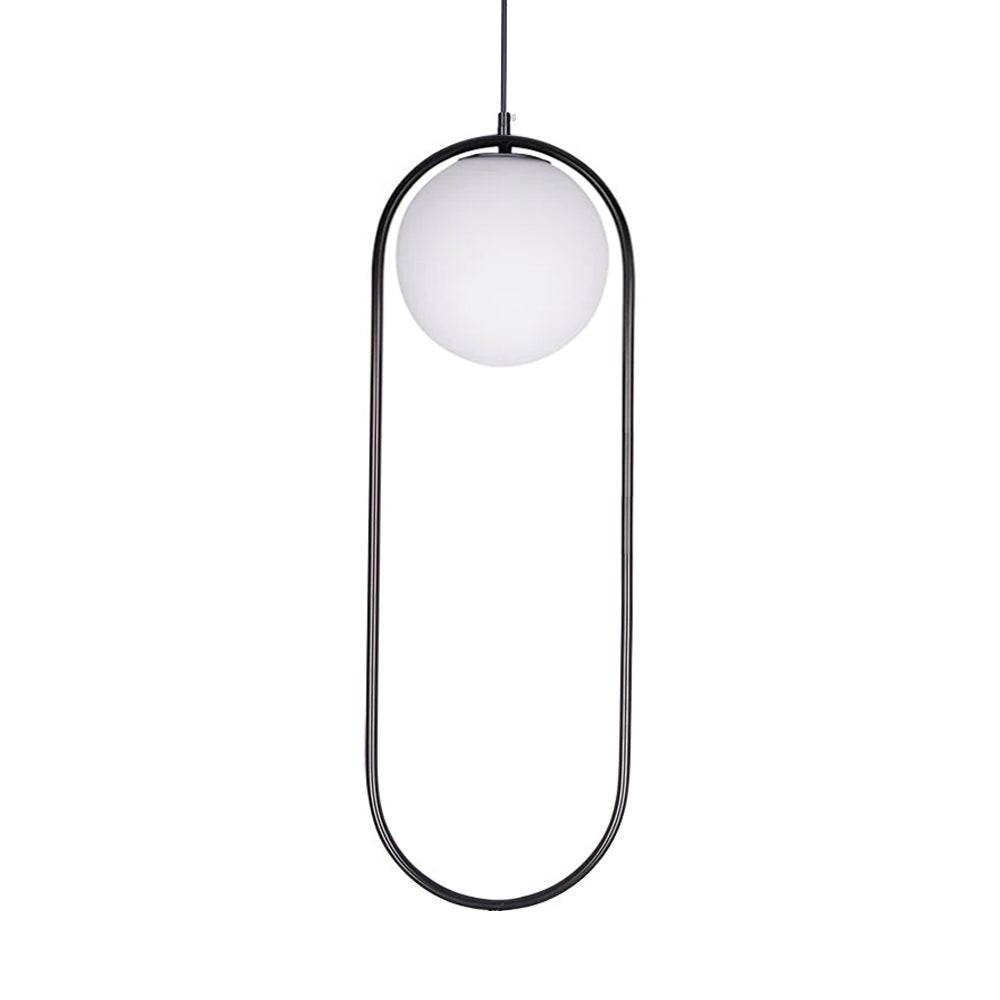 Glass ball pendant light glowing softly in a dining area