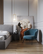 White glass globe pendant light glowing in a warm room