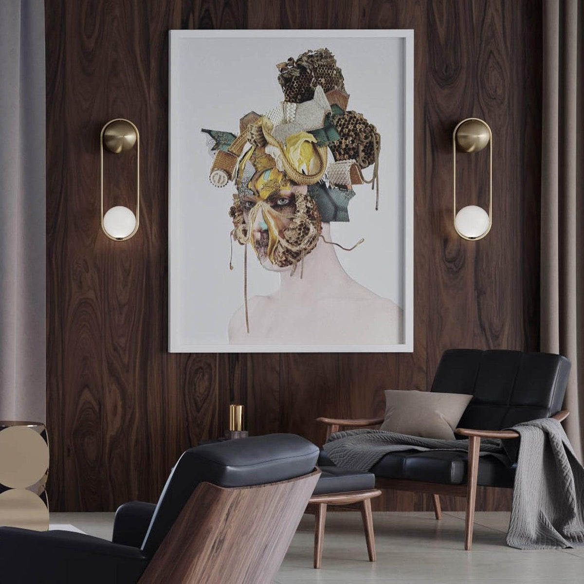 Two brass Clérachic wall lights flank a framed portrait above dark armchairs in a wood-panelled room.