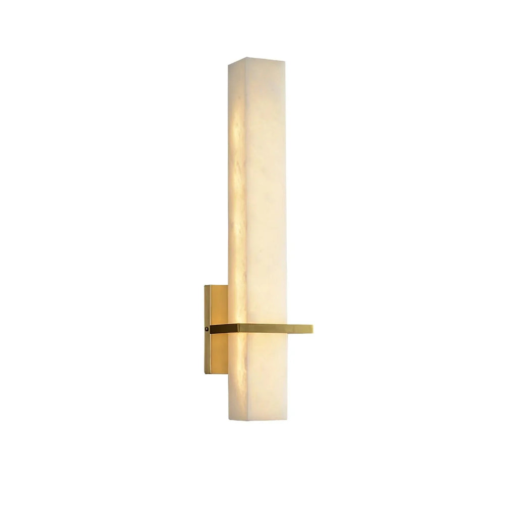 Close studio view of the lit alabaster block on white, warm light spilling along its front edge