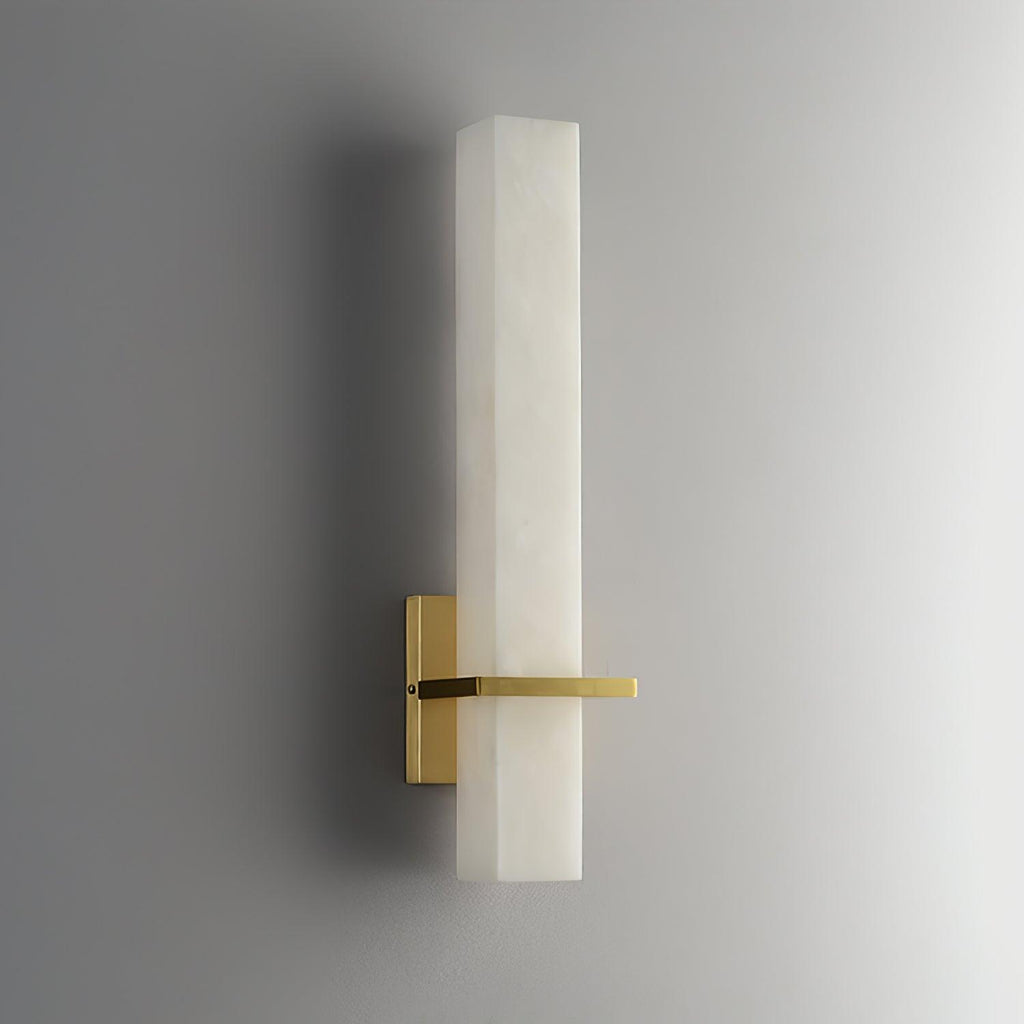 The wall light unlit, angled to show the square-cut edge of the alabaster block