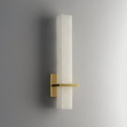 The wall light unlit, angled to show the square-cut edge of the alabaster block