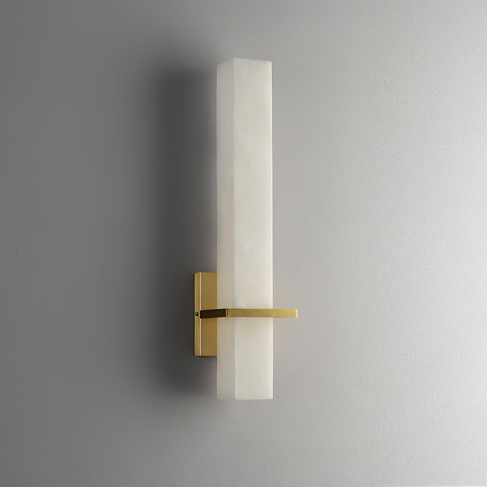 Unlit front view on grey, the brass arm and rectangular backplate standing off the alabaster