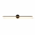 Slim linear LED wall lamp glowing above a vanity mirror