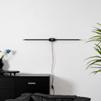 Minimalist bar lamp mounted on a bathroom wall