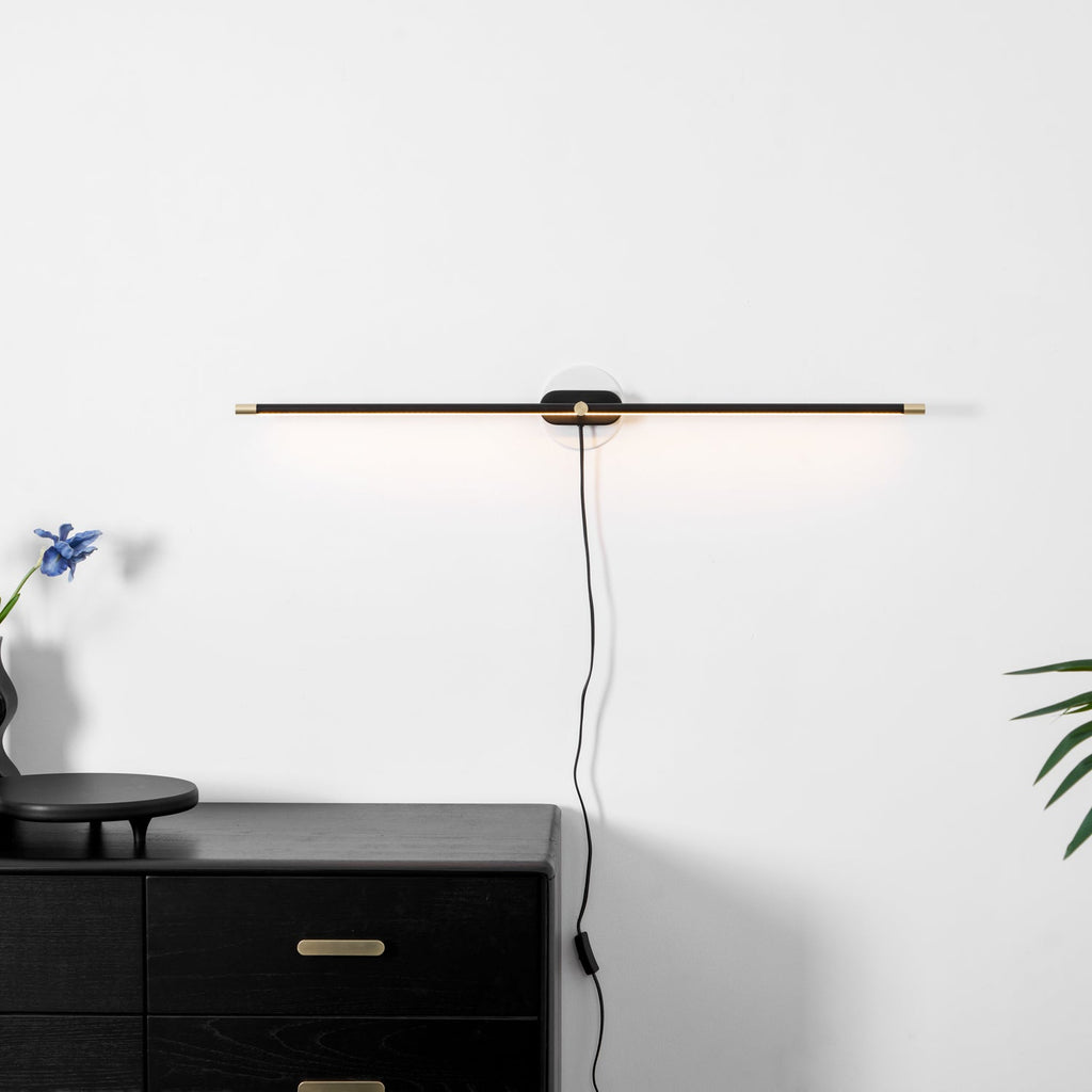 Slim LED bar lamp mounted above a mirror