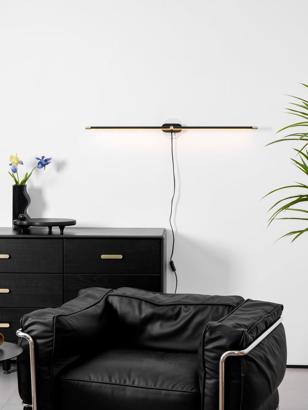 Minimalist linear lamp lighting a vanity area
