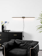 Minimalist linear lamp lighting a vanity area