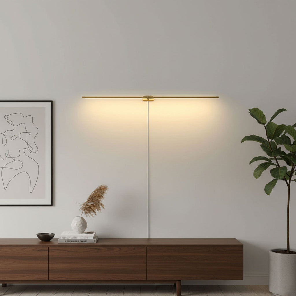 Linear wall lamp lighting artwork above a console