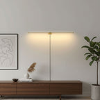 Linear wall lamp lighting artwork above a console