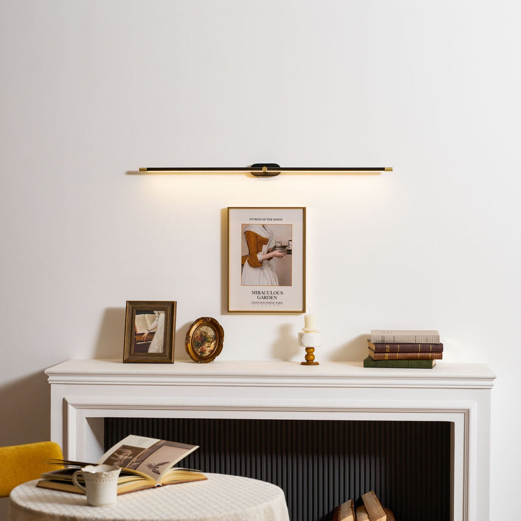 Linear LED wall lamp lighting a vanity mirror softly