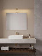 Minimalist linear wall lamp lighting a modern vanity space