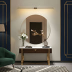 Linear wall lamp shown mounted along the top of a mirror