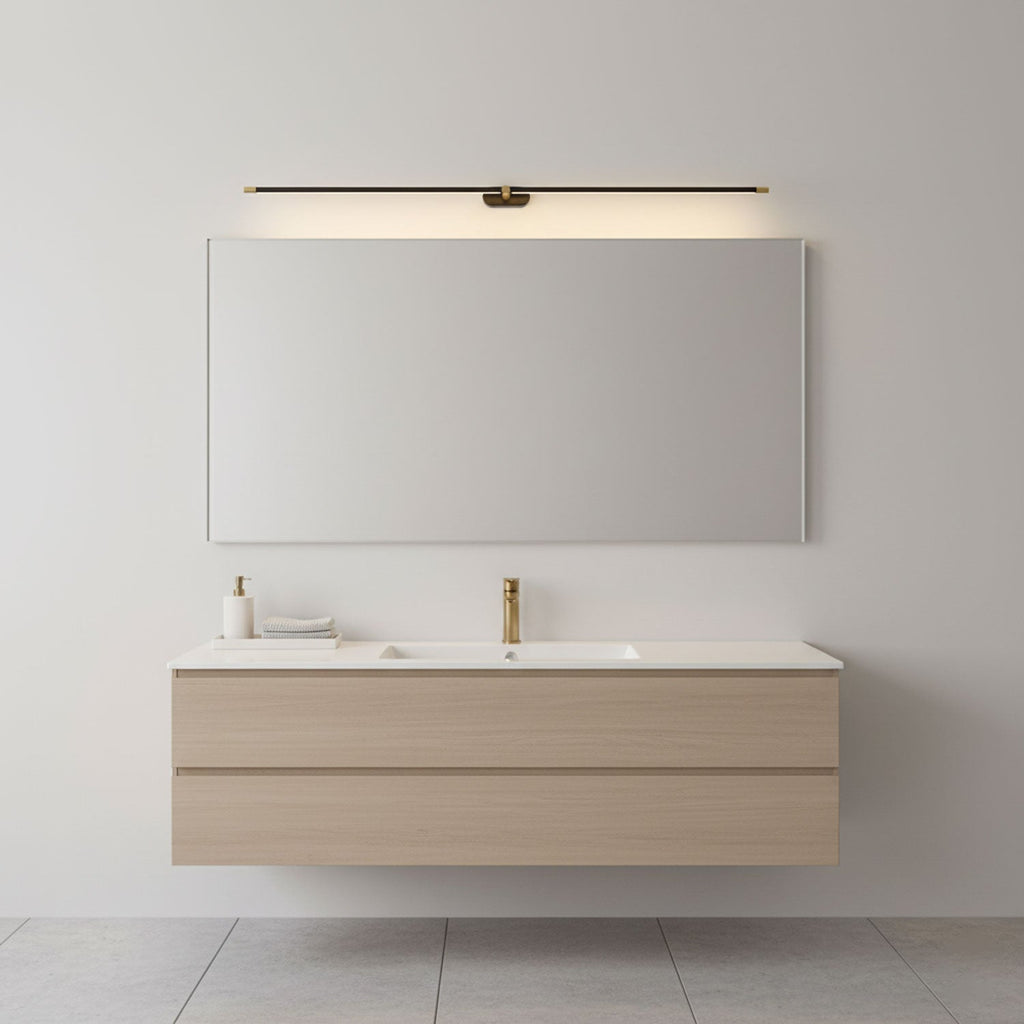 Minimalist linear wall lamp lit in a bright bathroom interior