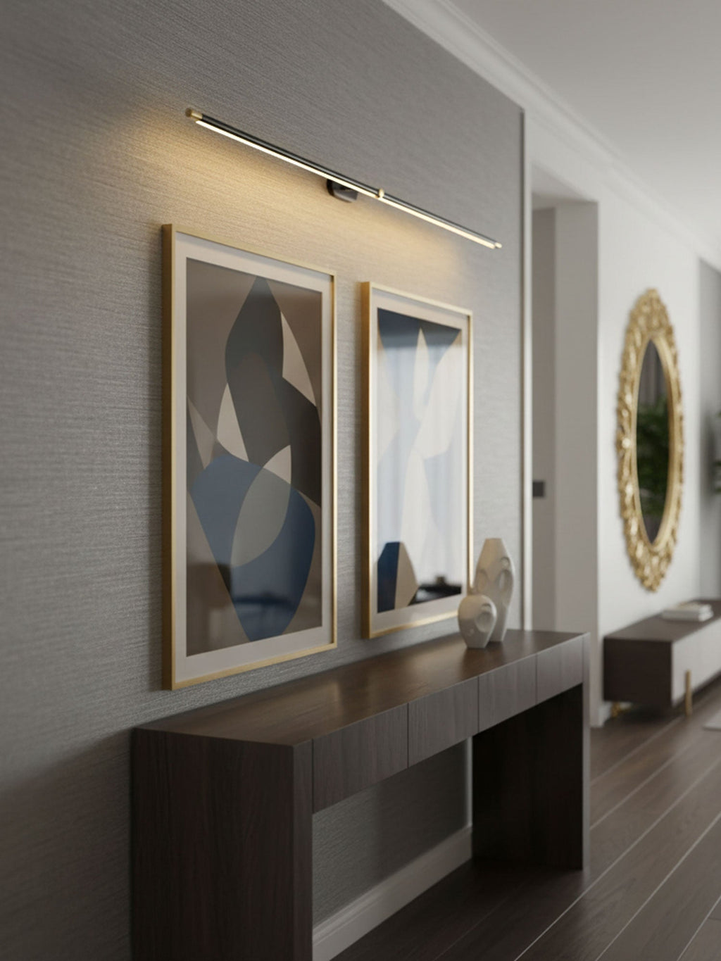 Linear wall lamp lit in a minimalist bathroom vanity setting