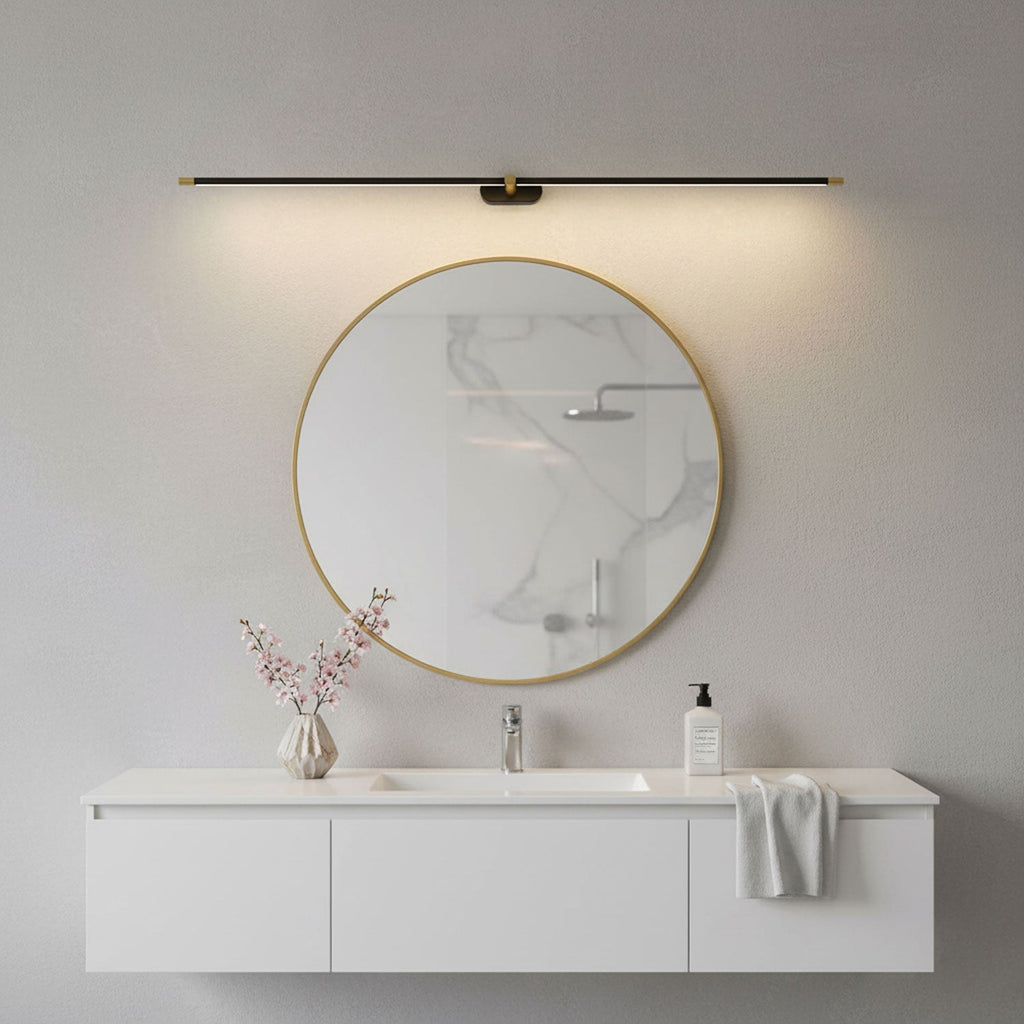 Linear wall lamp shown lighting a framed artwork on a wall