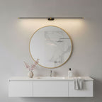 Linear wall lamp shown lighting a framed artwork on a wall