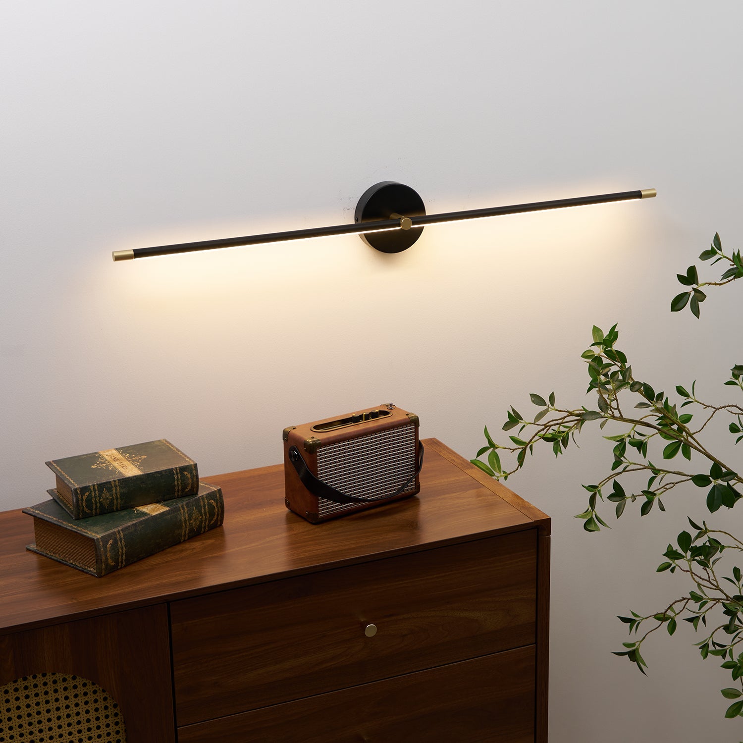 Wall lamp bar mounted horizontally above a mirror