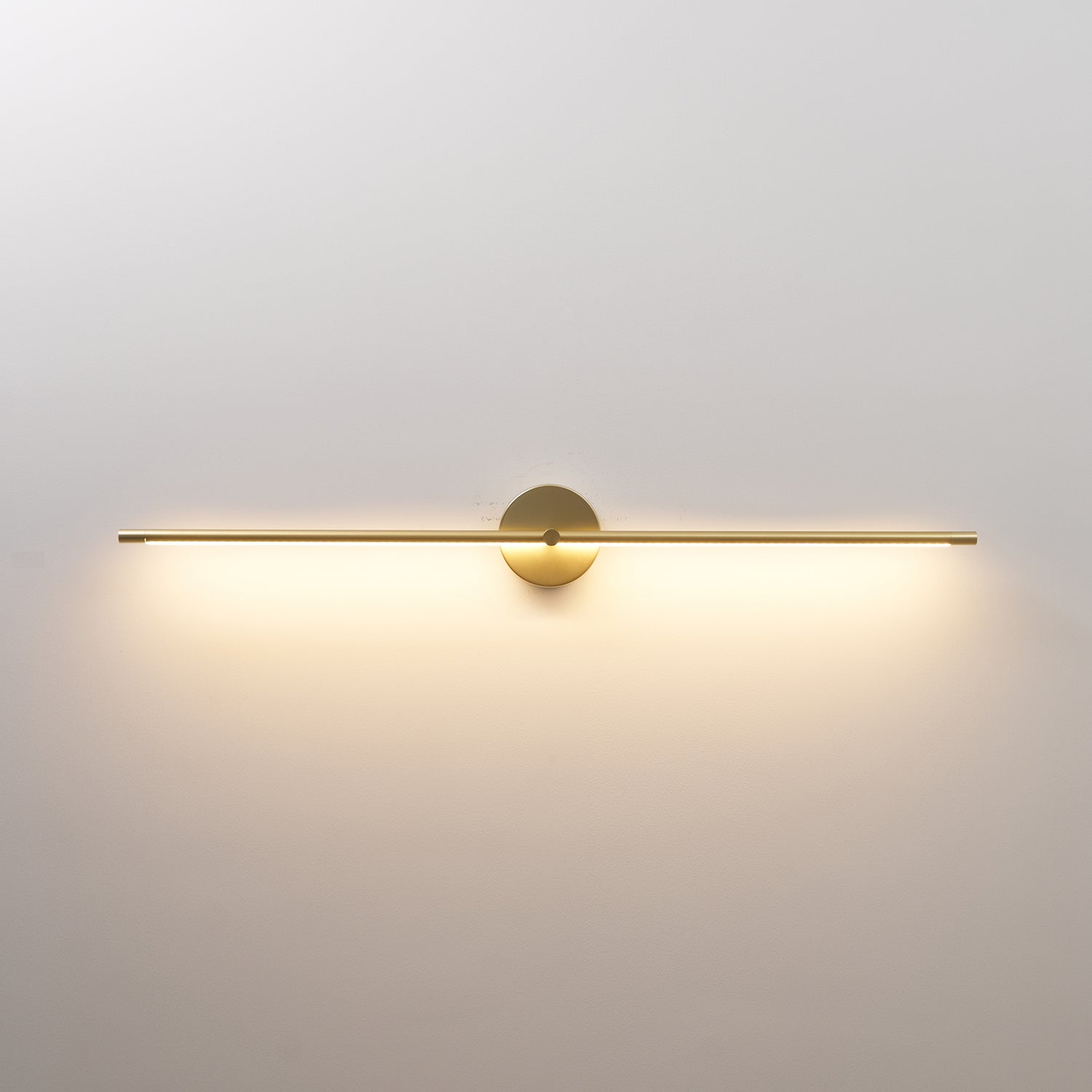 Wall lamp bar in black lighting a picture frame