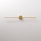 Slim linear LED wall lamp shown in warm ambient glow