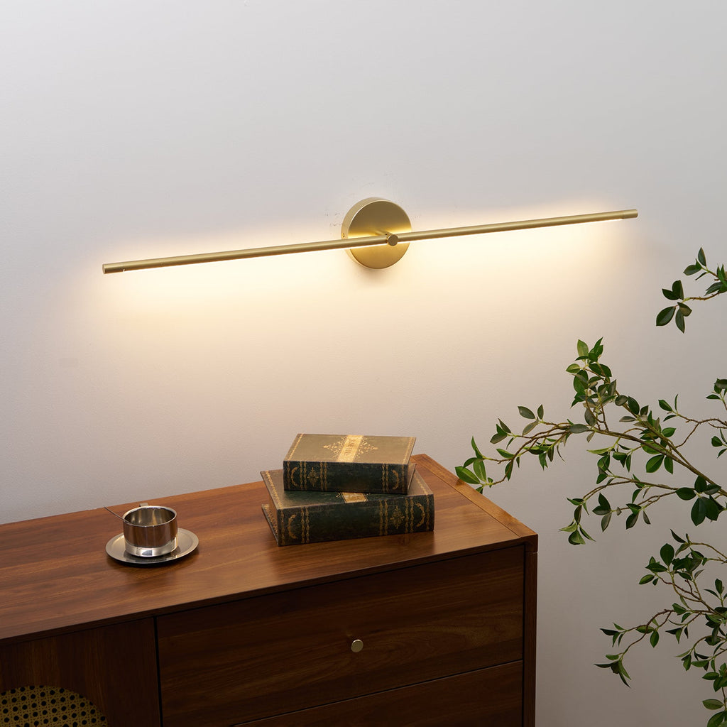 Slim wall lamp bar above a bathroom vanity mirror