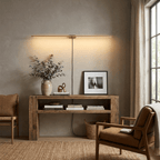 Linear wall lamp lighting a framed artwork on a wall