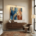 Cordless linear wall lamp with gold finish on white background