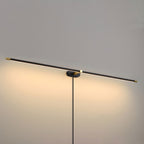 Slim LED wall lamp glowing warmly on a wall
