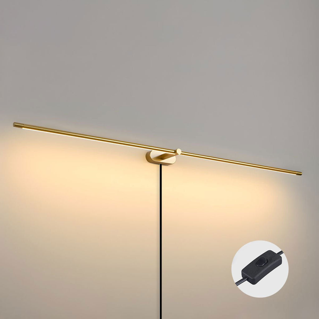 Slim linear LED wall lamp glowing above a vanity mirror