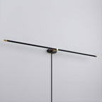 Slim LED bar lamp casting warm even light on a wall