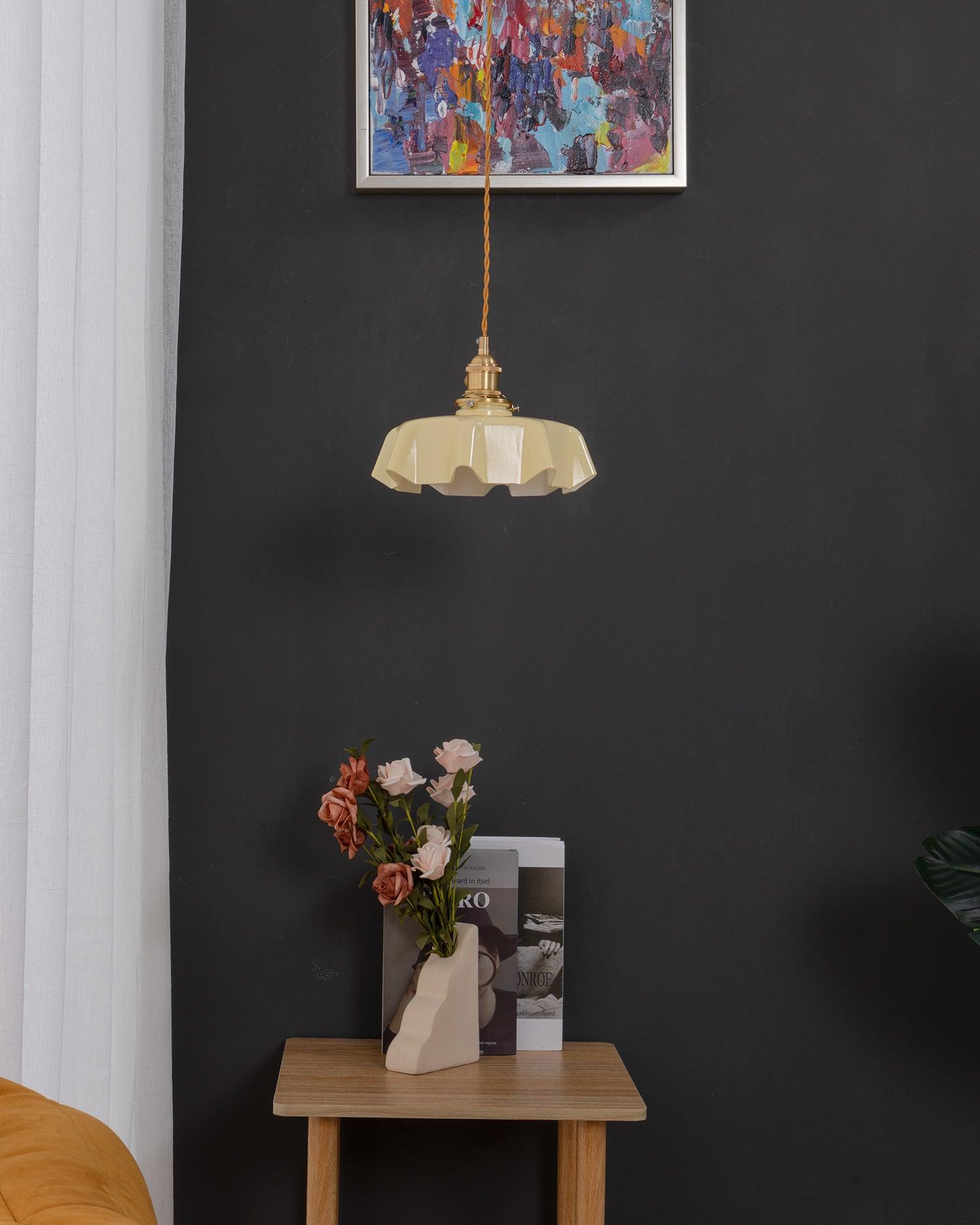 Pleated glass pendant light with brass body and gentle glow