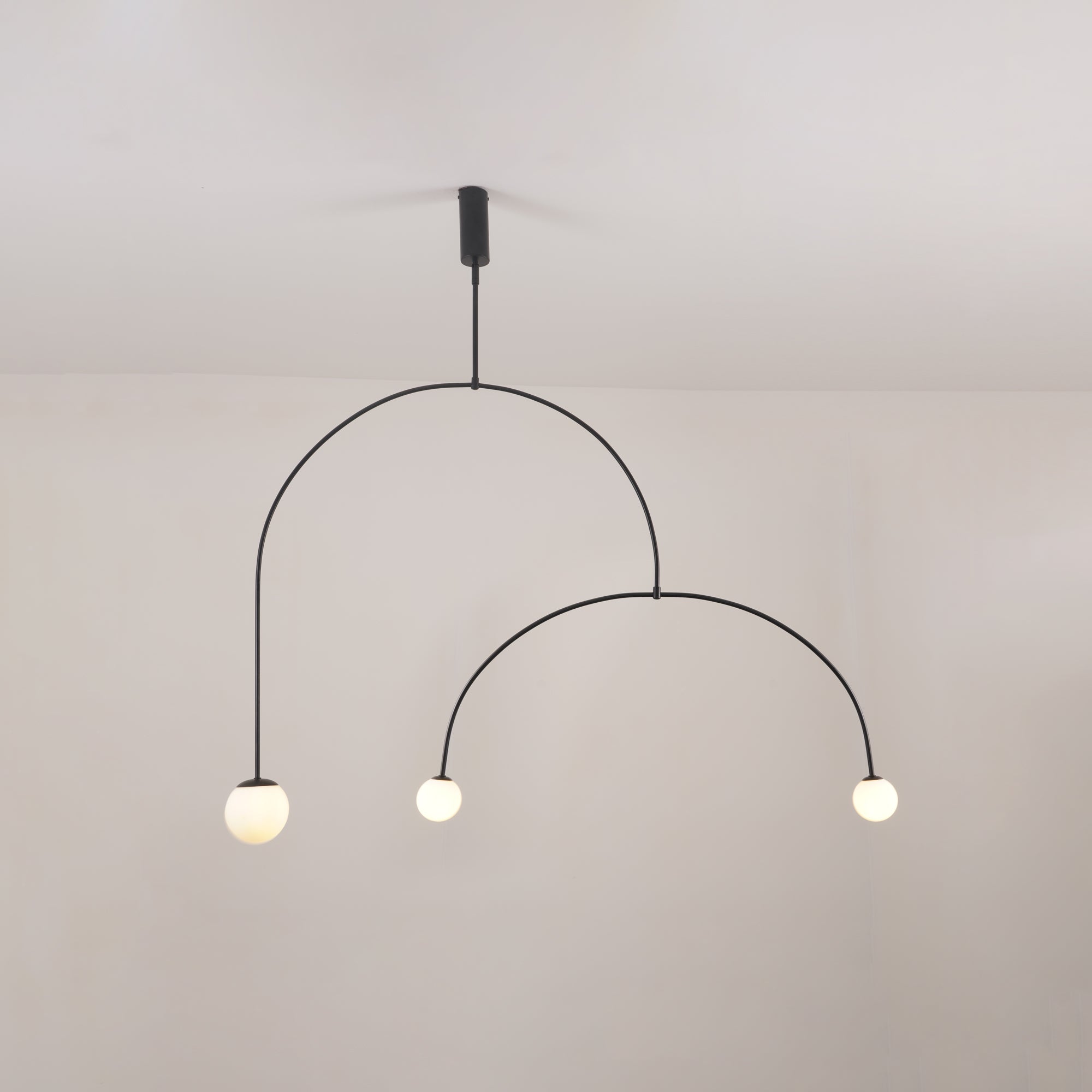 Mobile chandelier in gold finish with white glass globes