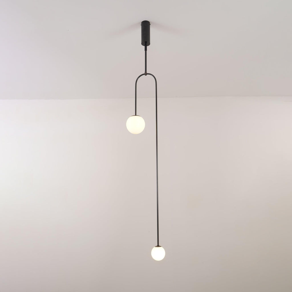 Minimalist chandelier with glowing globes over a living room