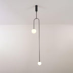 Minimalist chandelier with glowing globes over a living room