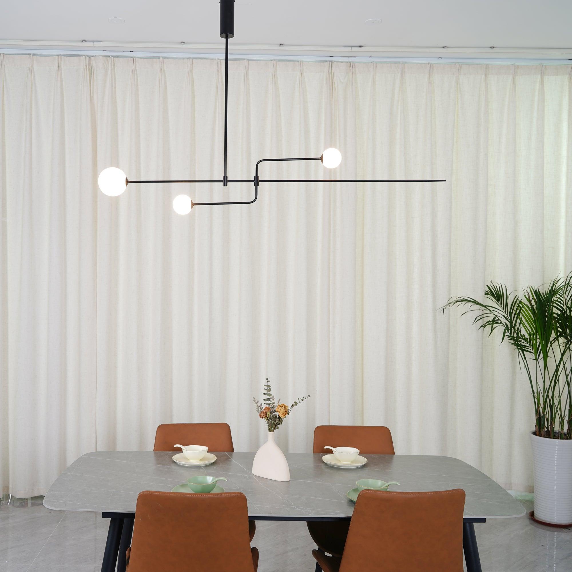 Graphic chandelier with white glass globes on black frame