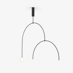 Mobile chandelier with white glass globes over a dining table